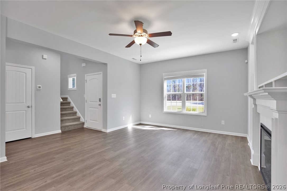 258 Fieldbrook Street Raeford, NC 28376 - Photo 8 of 40 a view of an empty room with wooden floor and a window