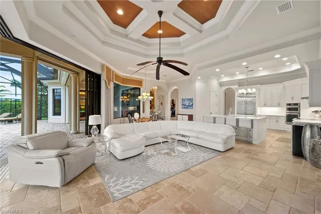 a view of a dining room with furniture and chandelier