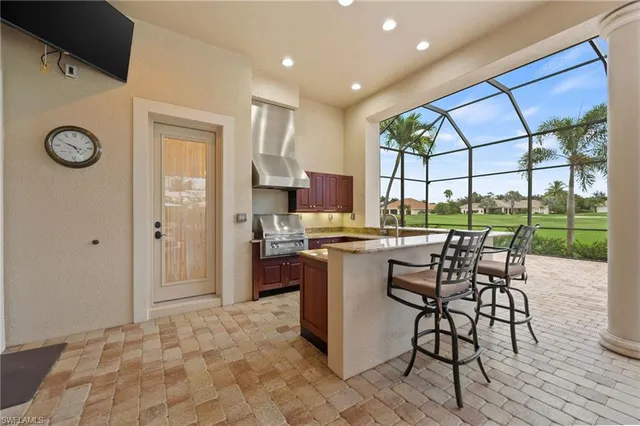 a kitchen with a sink and a stove