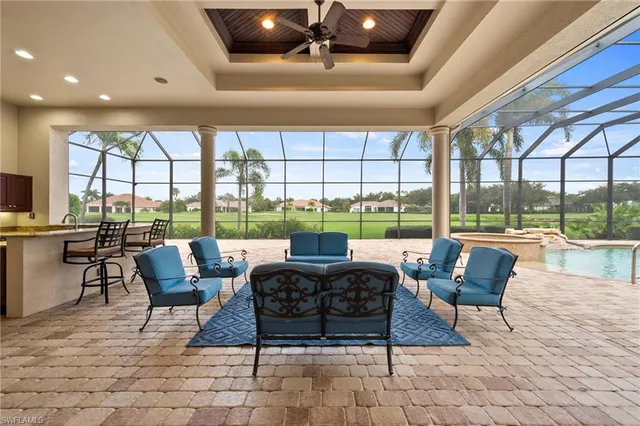 a view of a swimming pool with a patio