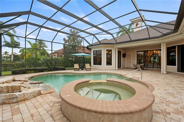 a view of a swimming pool with a patio