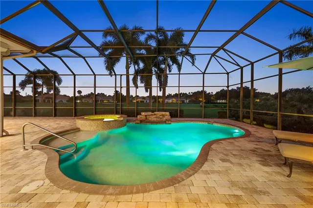 a view of a swimming pool with a patio