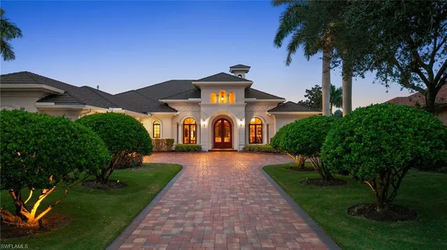 a front view of a house with yard