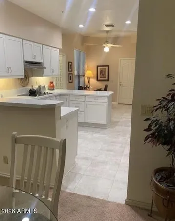 a kitchen with stainless steel appliances granite countertop a refrigerator sink and cabinets