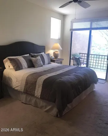 a bedroom with a bed and window