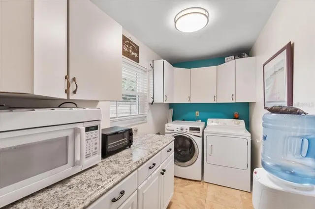 a kitchen with a stove top oven sink and cabinets