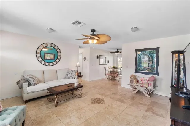 a living room with furniture a rug and a window