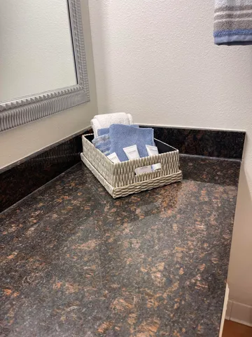 a bathroom with a sink and mirror