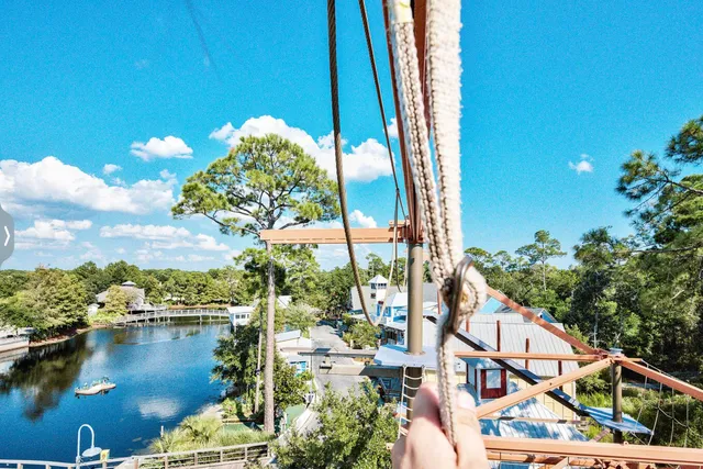 a view of a chair and tables in backyard of the house