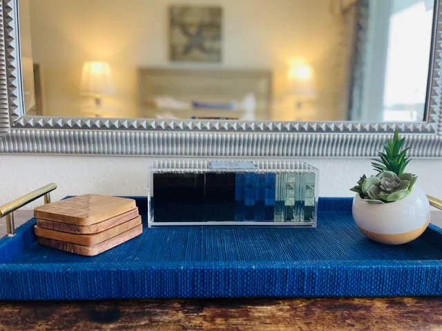 a living room with a couch and a potted plant