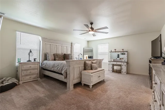 a bedroom with furniture and white walls