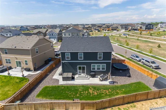 a view of a house with swimming pool and a yard