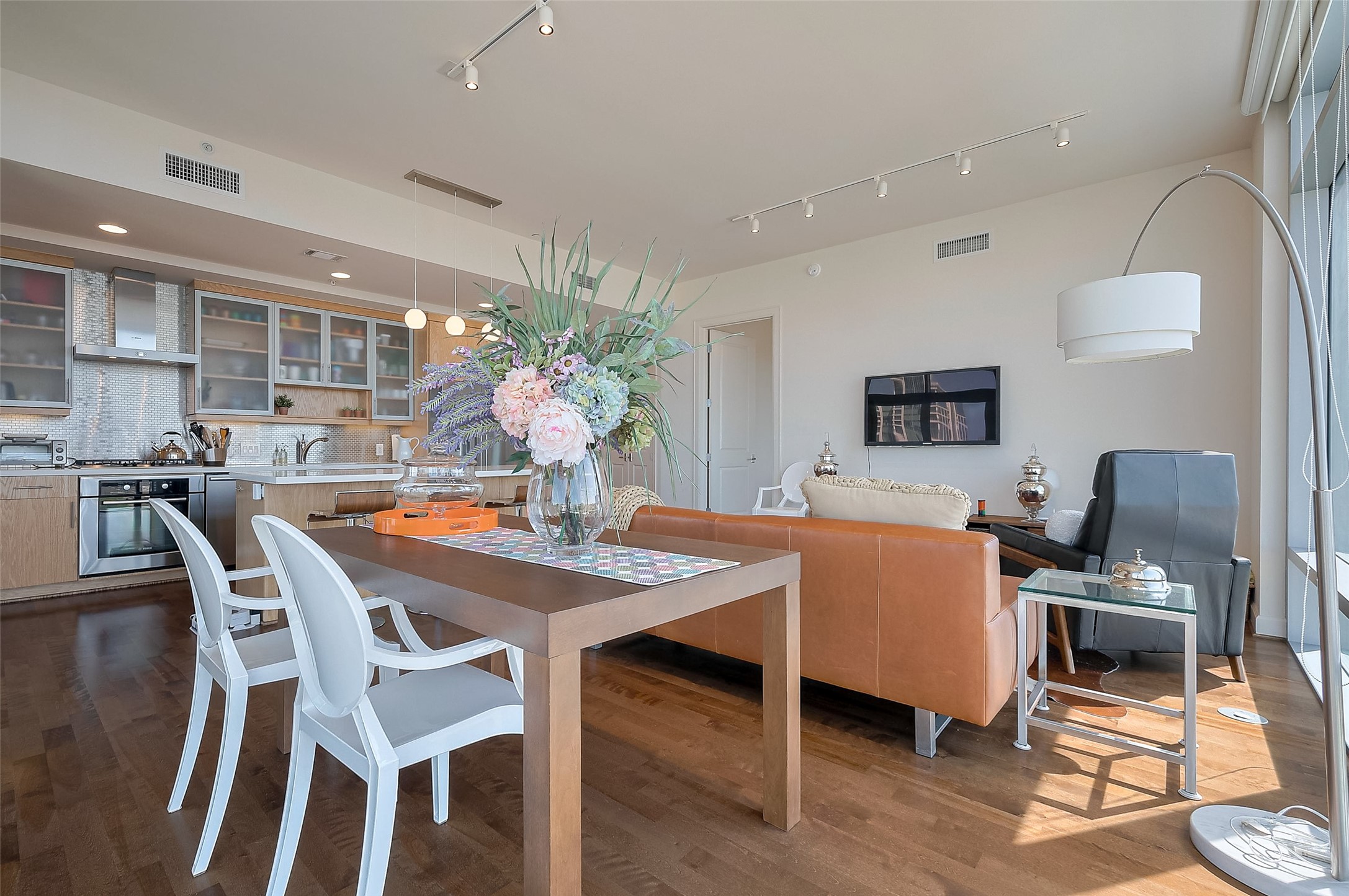 2207 Bancroft Lane, Unit 604 Houston, TX 77027 - Photo 15 of 35 a dining room with furniture and wooden floor