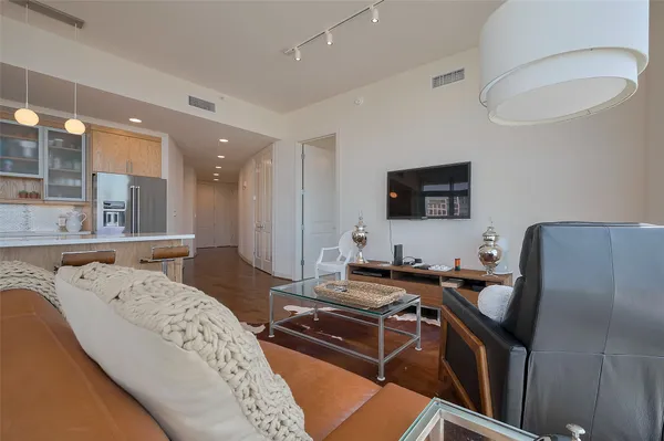 a living room with furniture and flat screen tv
