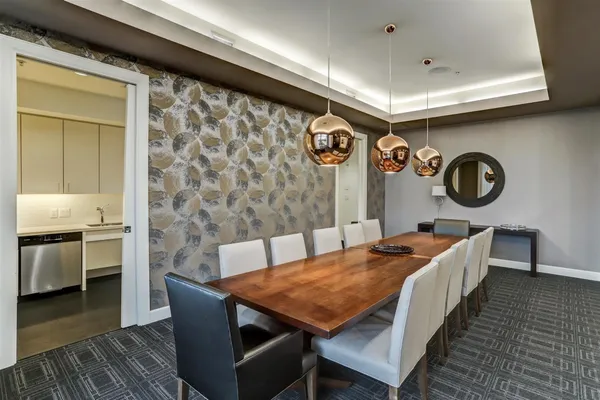 a dinning table and chairs in a room
