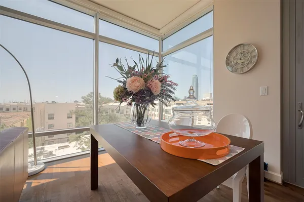 a view of a dining room with furniture and a window