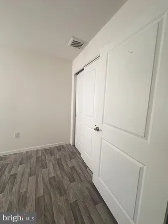 a view of small space with wooden floor