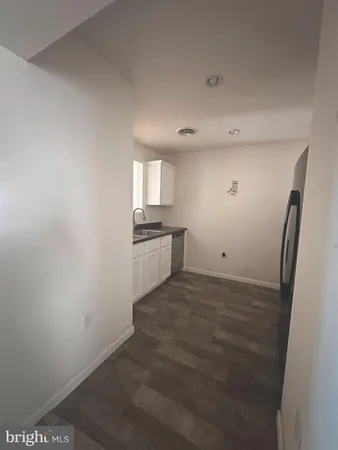 a view of a kitchen with a sink