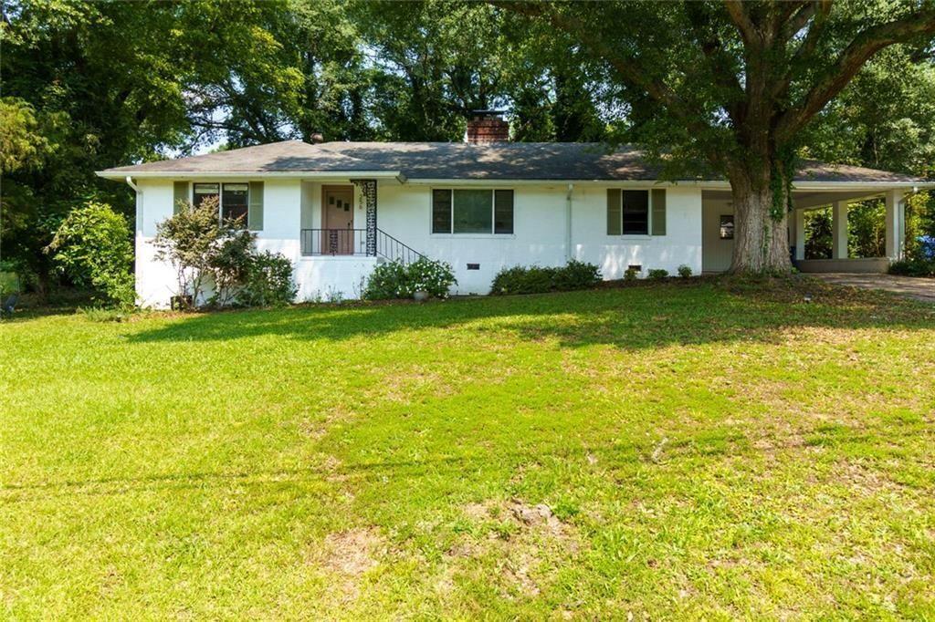 256 4th Avenue Winder, GA 30680 - Photo 1 of 1 a front view of house with yard and green space