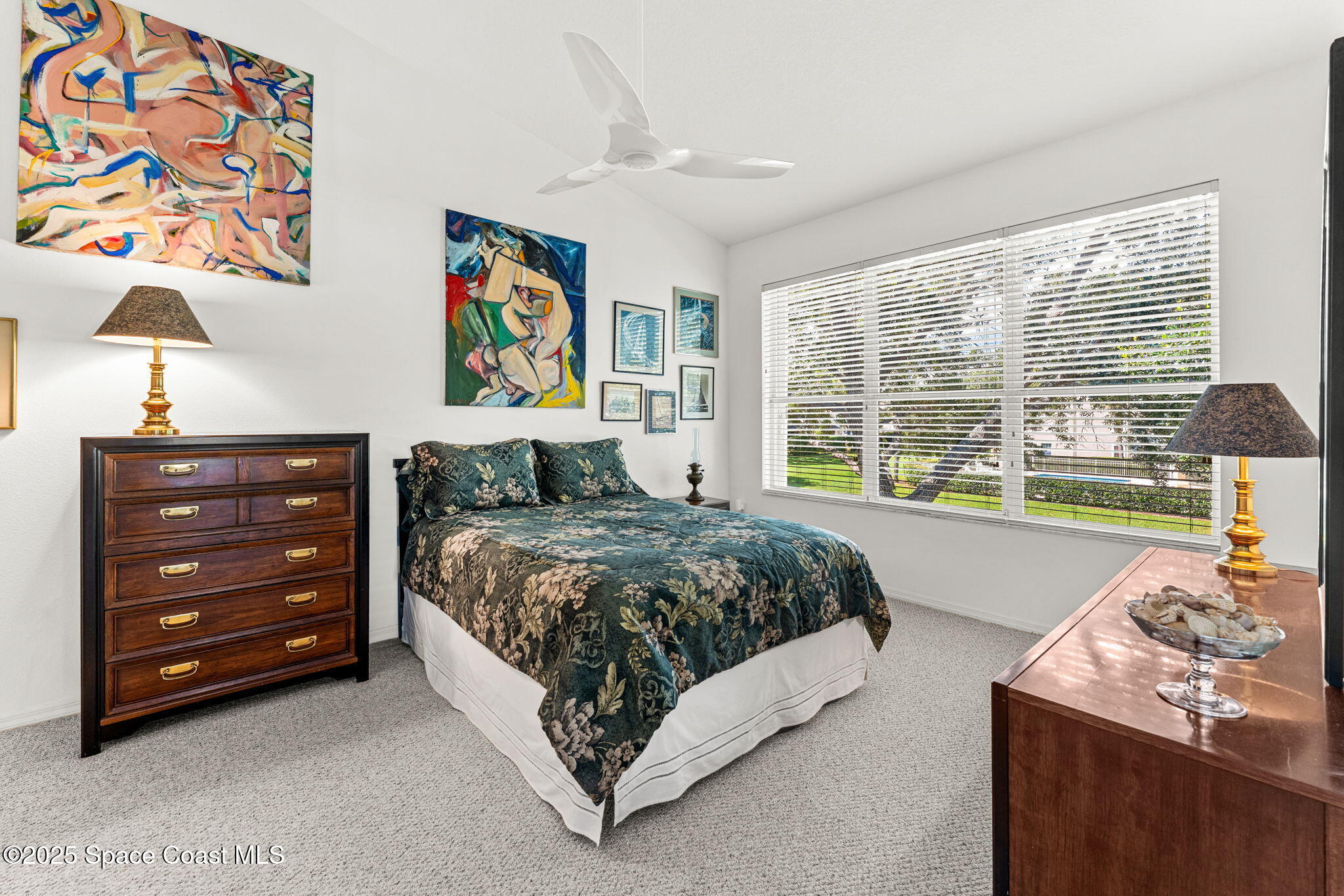 400 Trotter Lane, Unit 204 Melbourne, FL 32940 - Photo 15 of 38 a bedroom with a bed and a window