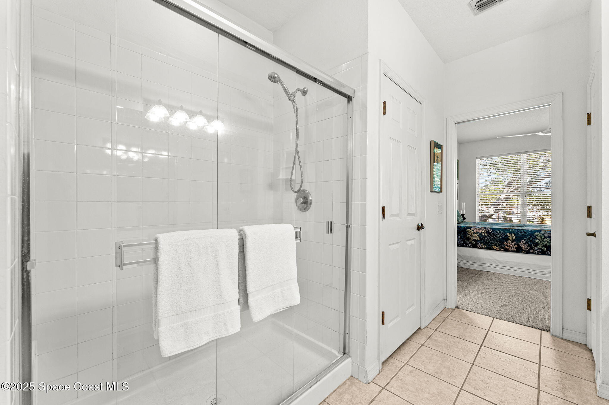 400 Trotter Lane, Unit 204 Melbourne, FL 32940 - Photo 17 of 38 a bathroom with a shower and a tub