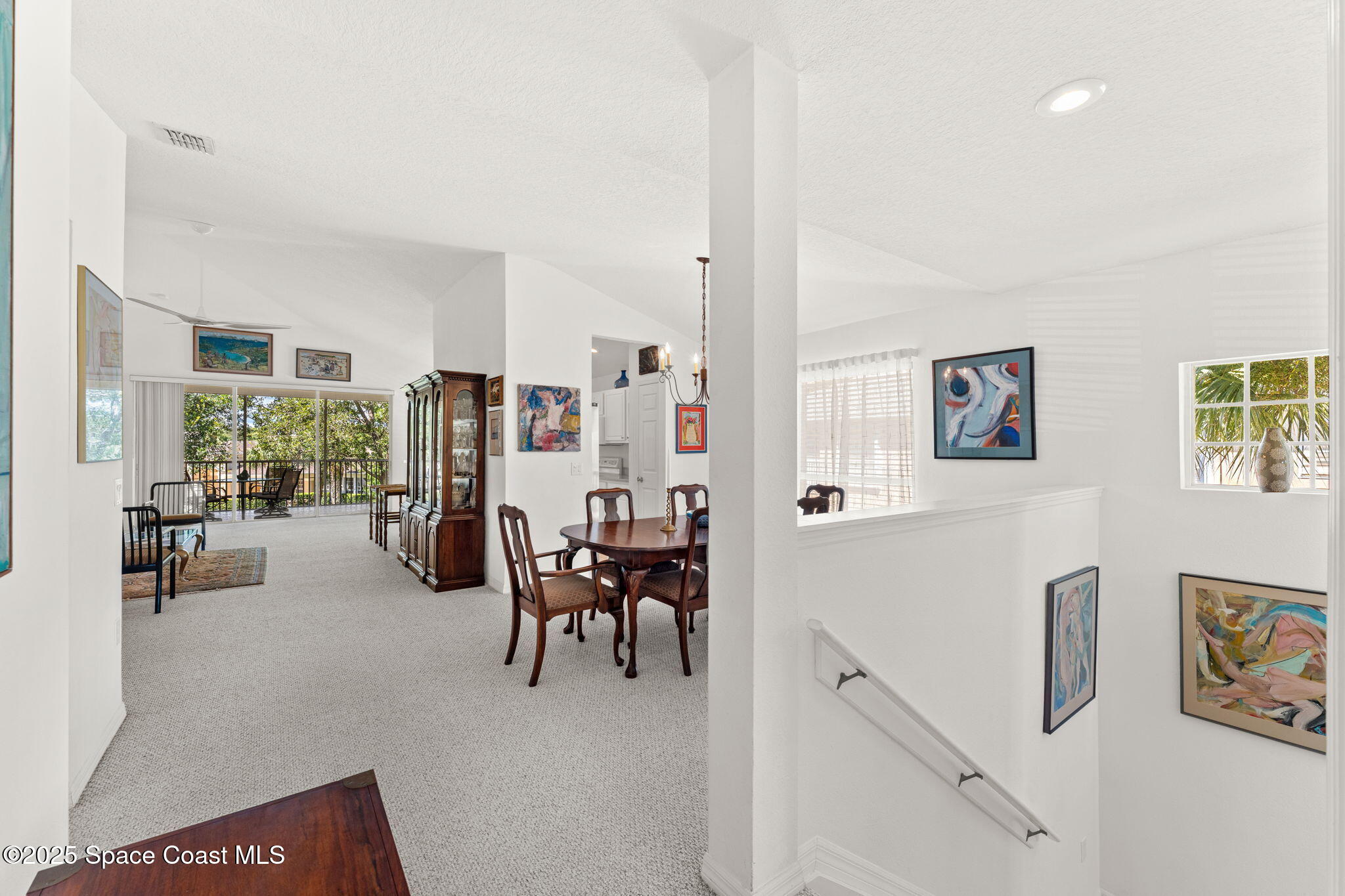 400 Trotter Lane, Unit 204 Melbourne, FL 32940 - Photo 2 of 38 a living room with furniture and a large window