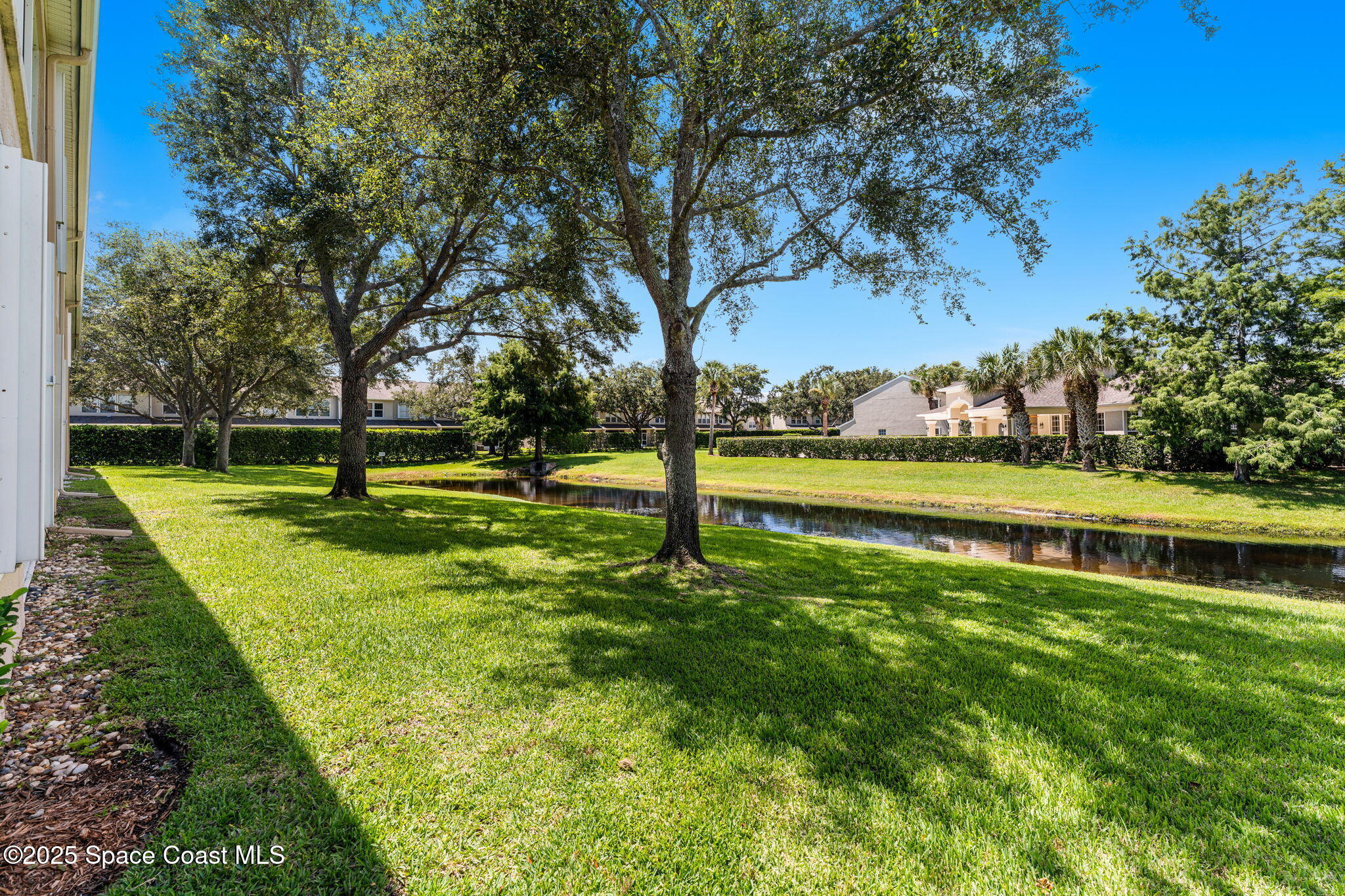 400 Trotter Lane, Unit 204 Melbourne, FL 32940 - Photo 24 of 38 a view of a park with large trees