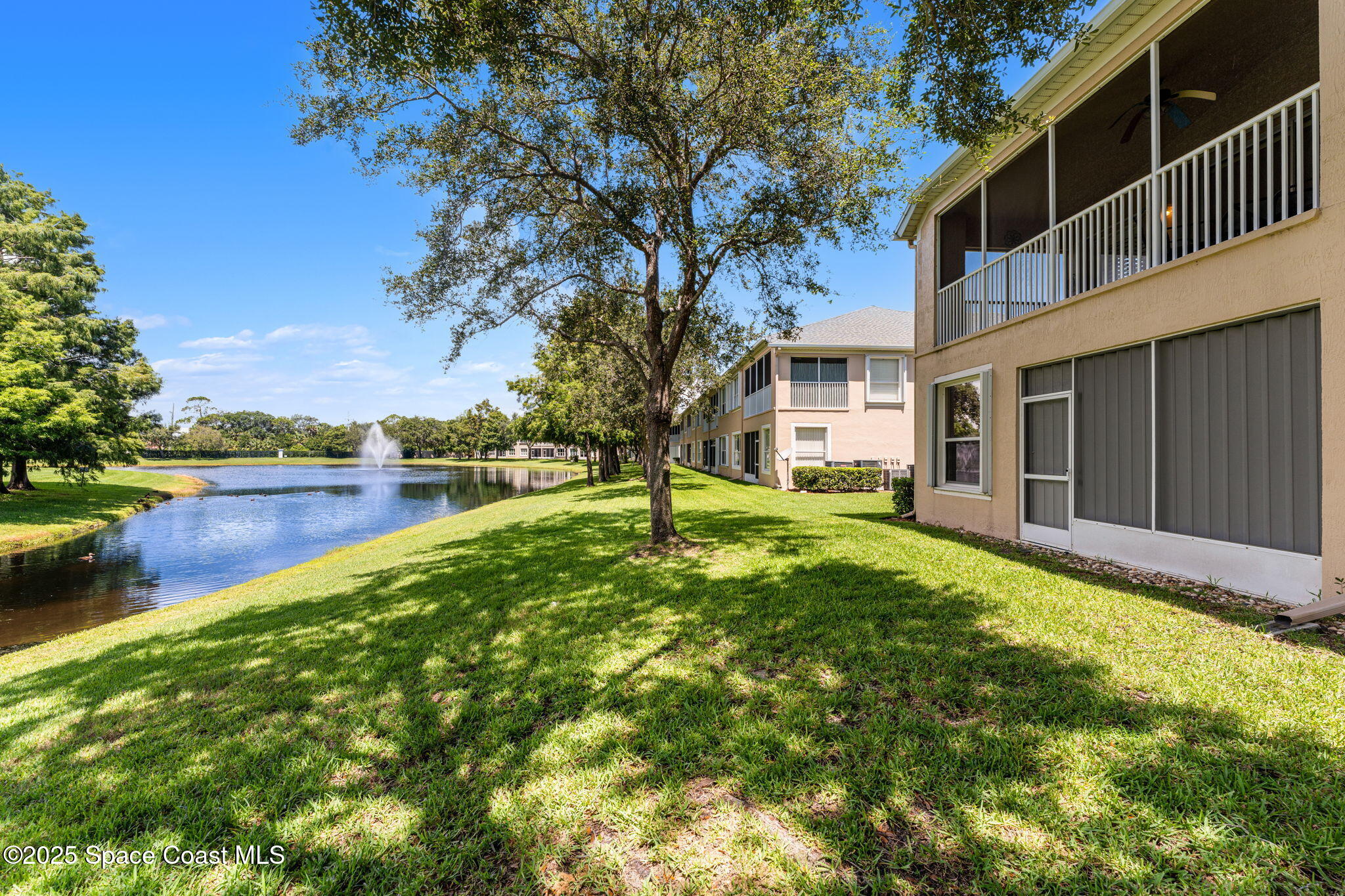 400 Trotter Lane, Unit 204 Melbourne, FL 32940 - Photo 25 of 38 a view of a house with a yard