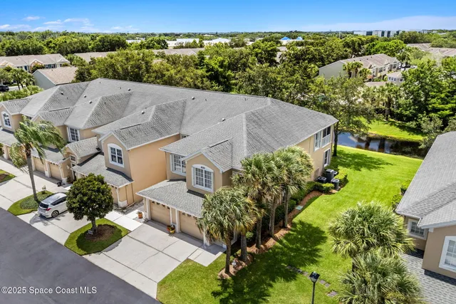 an aerial view of a house with a garden