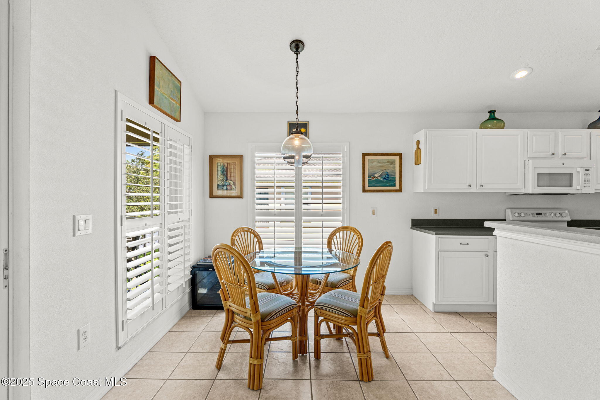 400 Trotter Lane, Unit 204 Melbourne, FL 32940 - Photo 8 of 38 a dining room with furniture and window