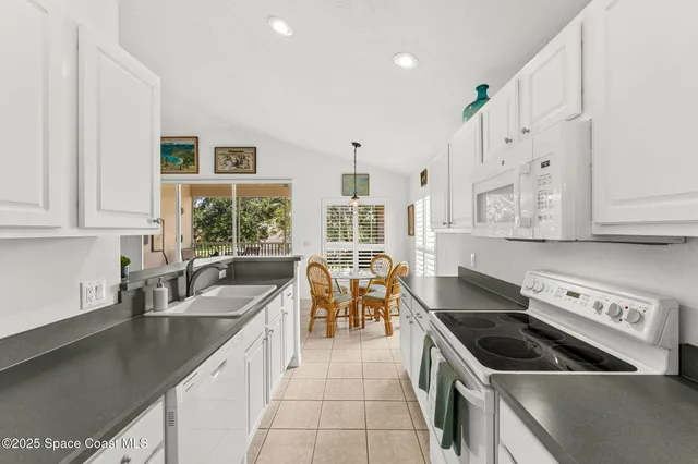 a kitchen that has a sink and a stove