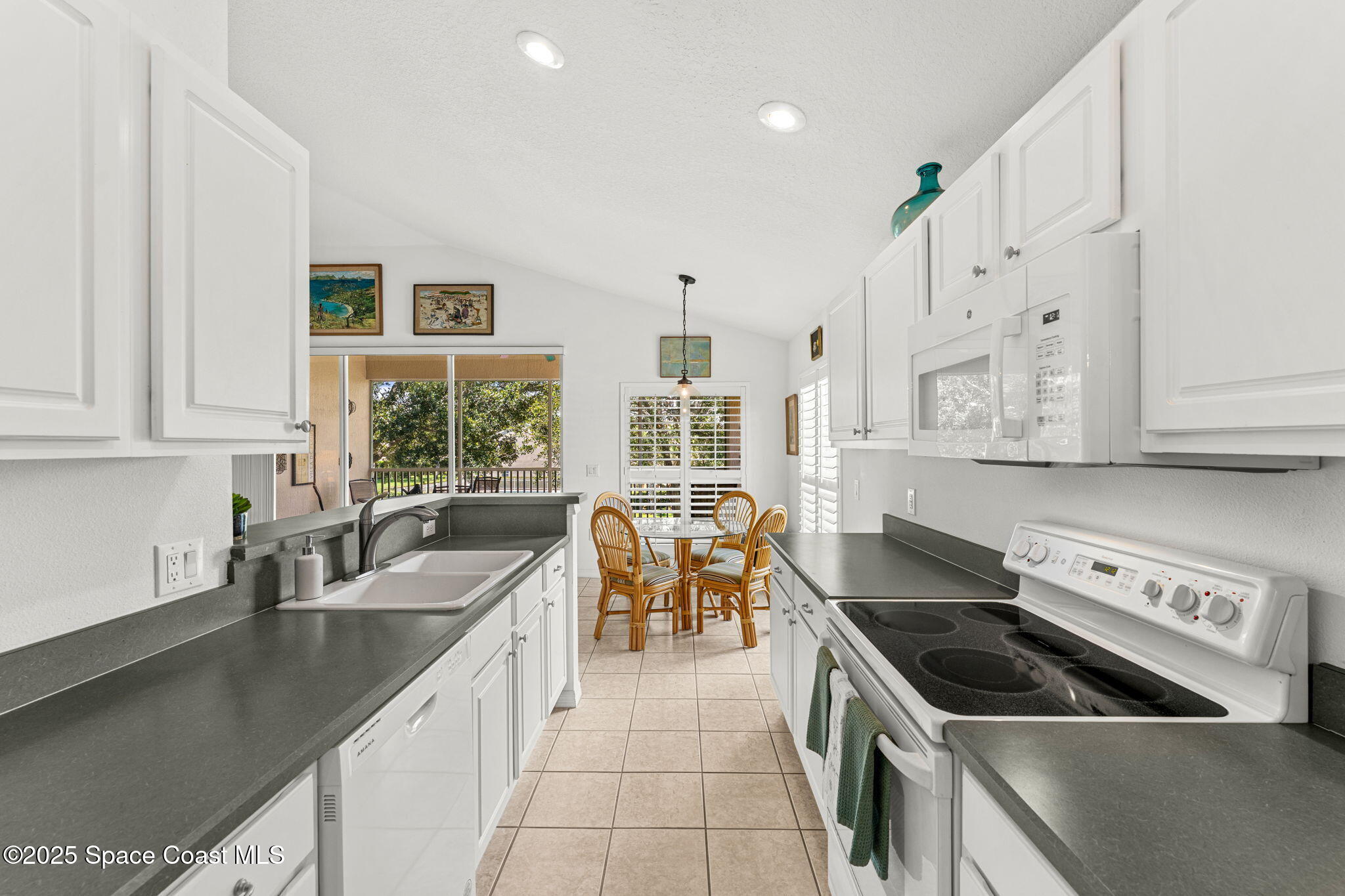 400 Trotter Lane, Unit 204 Melbourne, FL 32940 - Photo 9 of 38 a kitchen that has a sink and a stove