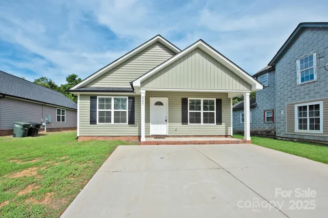 a front view of a house with a yard and porch