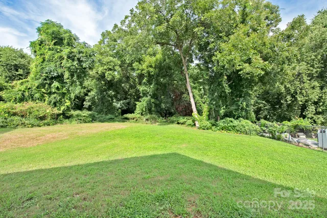 a view of outdoor space with deck and yard