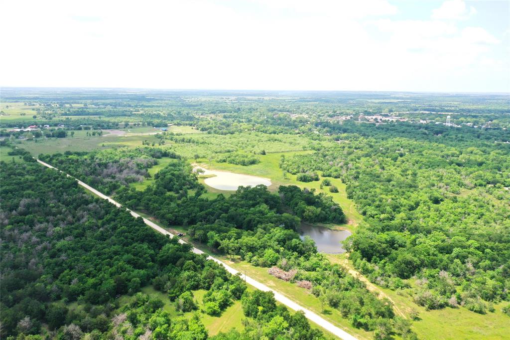 123 Fcr 1000 Road Wortham, TX 76693 - Photo 3 of 18 an aerial view of residential houses with outdoor space and trees