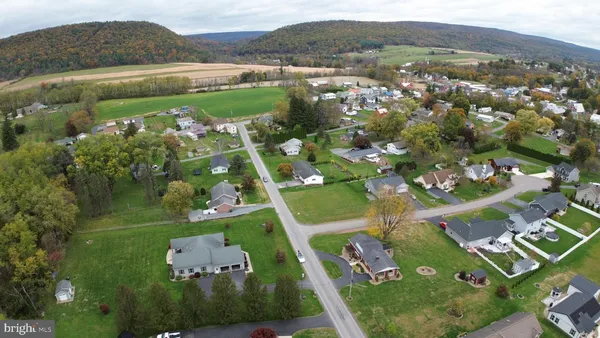 an aerial view of a house with a garden