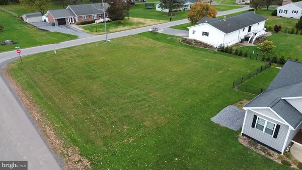 a view of backyard with outdoor space and car parked
