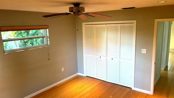 a view of a living room and floor to ceiling windows