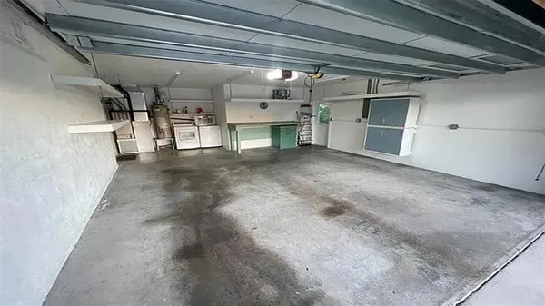 a view of a park with iron fence