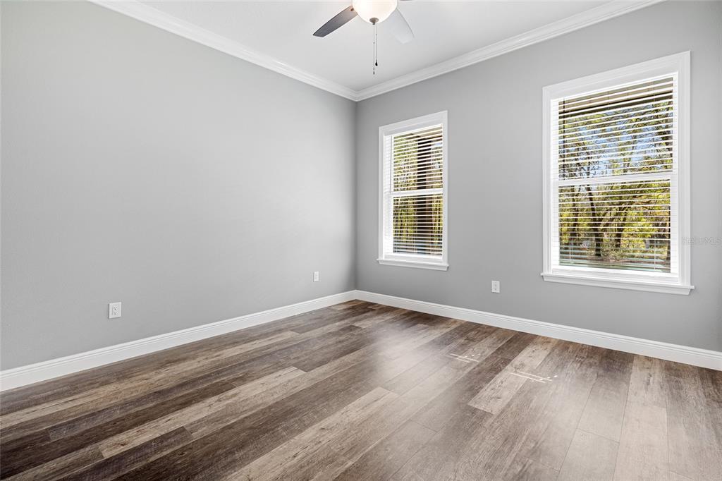 3183 East Fawn Court Inverness, FL 34452 - Photo 15 of 33 a view of an empty room with wooden floor and a window