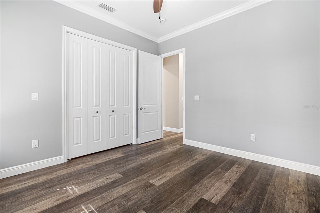 3183 East Fawn Court Inverness, FL 34452 - Photo 16 of 33 a view of an empty room with wooden floor