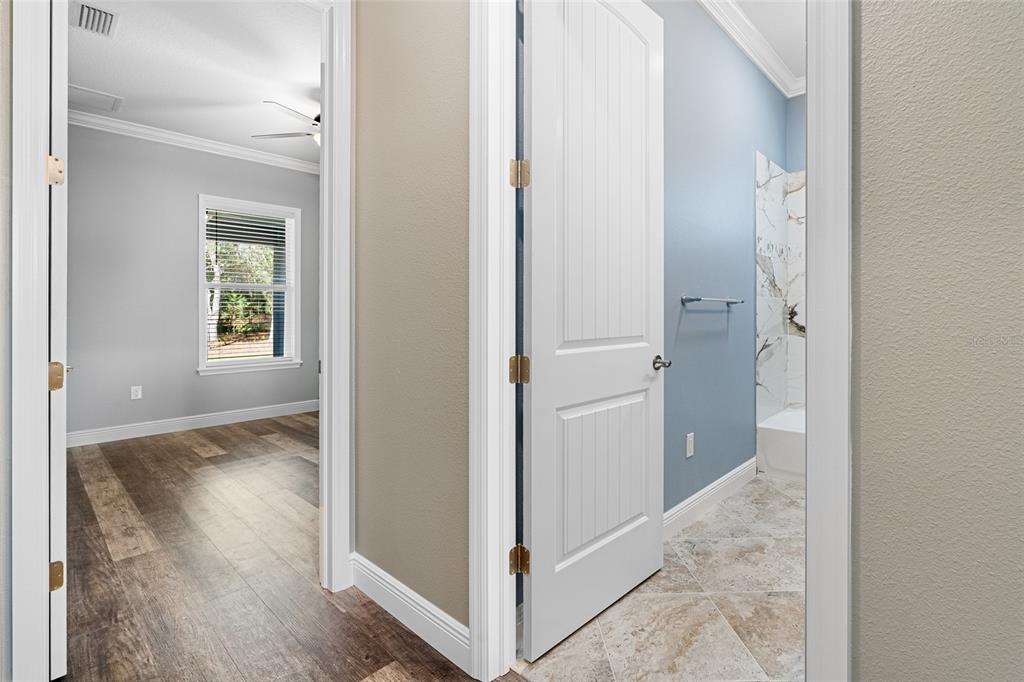 3183 East Fawn Court Inverness, FL 34452 - Photo 17 of 33 a view of a hallway with wooden floor