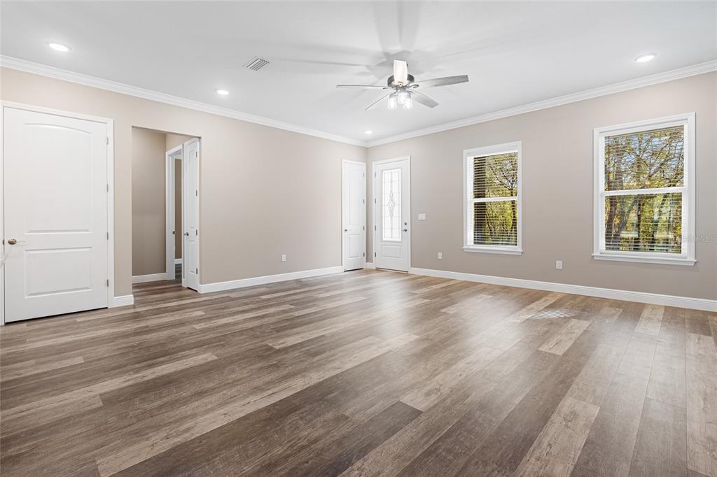 3183 East Fawn Court Inverness, FL 34452 - Photo 3 of 33 a view of an empty room with wooden floor and window