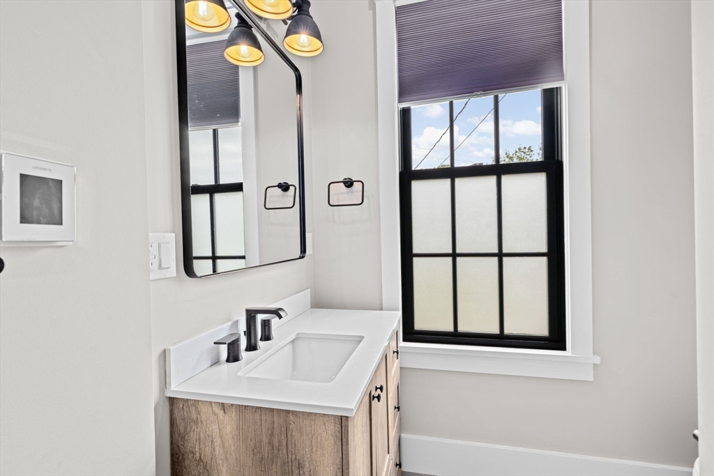 42 Captain Peirce Road Scituate, MA 02066 - Photo 13 of 40 a bathroom with a sink and a mirror