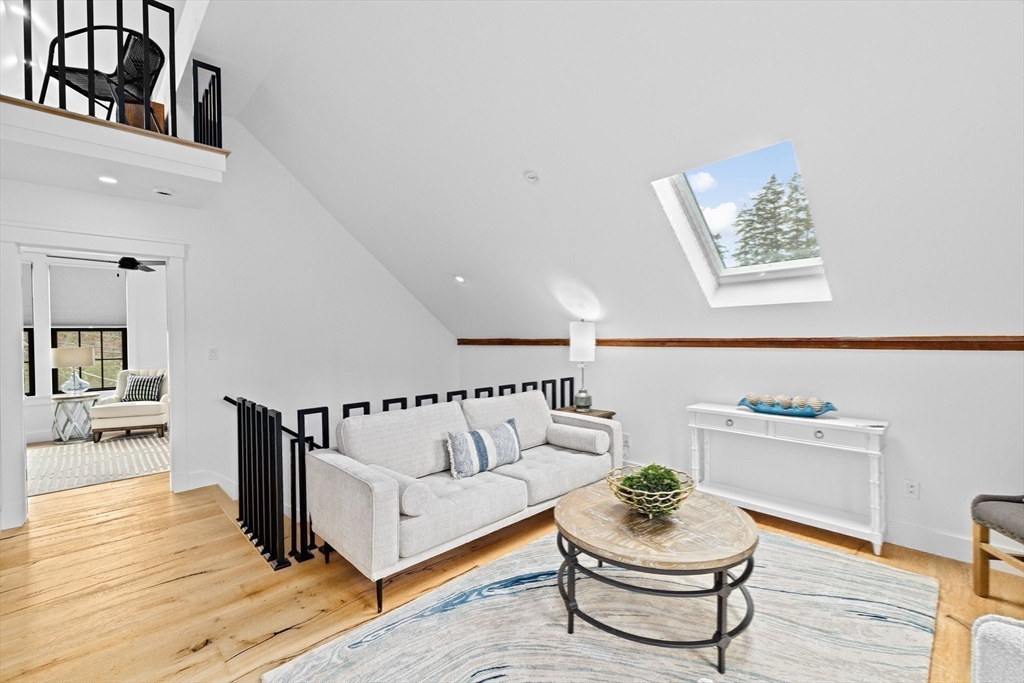 42 Captain Peirce Road Scituate, MA 02066 - Photo 16 of 40 a living room with furniture and a wooden floor