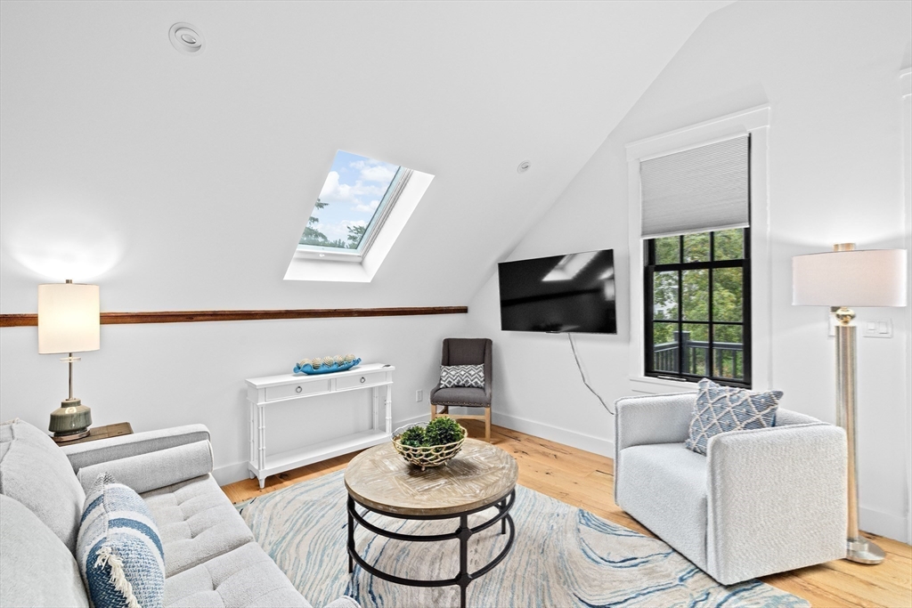 42 Captain Peirce Road Scituate, MA 02066 - Photo 17 of 40 a living room with furniture and a flat screen tv