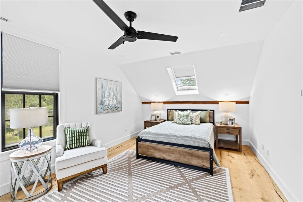 42 Captain Peirce Road Scituate, MA 02066 - Photo 19 of 40 a bedroom with a bed and wooden floor