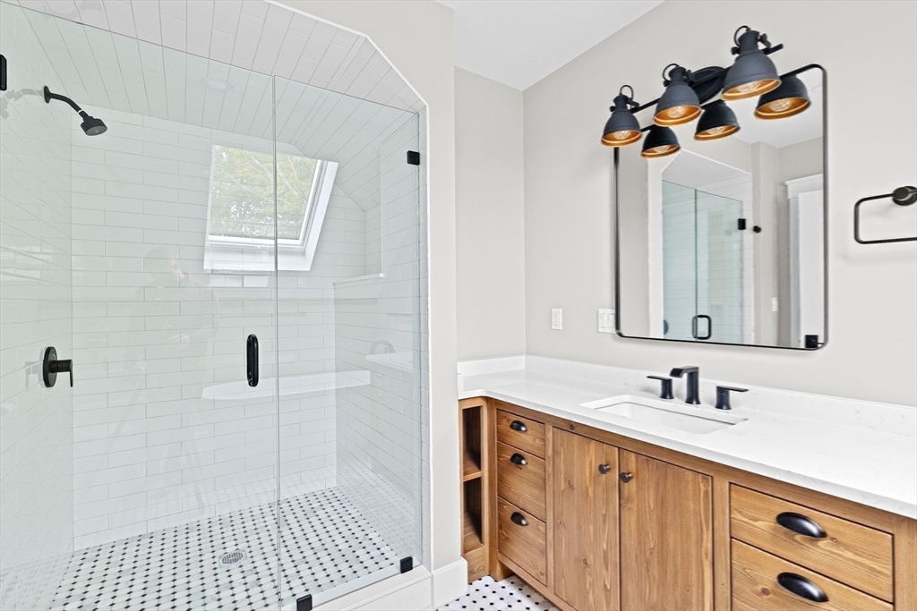 42 Captain Peirce Road Scituate, MA 02066 - Photo 23 of 40 a bathroom with a sink a vanity and a mirror