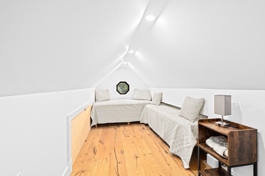 42 Captain Peirce Road Scituate, MA 02066 - Photo 30 of 40 a bedroom with a bed and a table