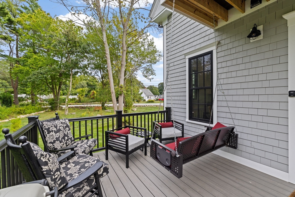 42 Captain Peirce Road Scituate, MA 02066 - Photo 37 of 40 a view of a patio with couches chairs and a wooden floor